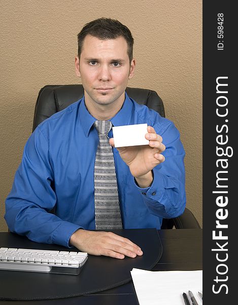 Stressed looking guy showing a blank business card. Stressed looking guy showing a blank business card