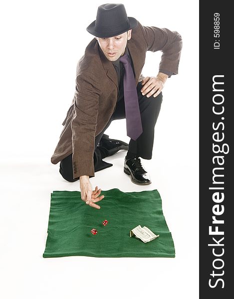 Slick mobster throwing the dice, isolated on white. Slick mobster throwing the dice, isolated on white