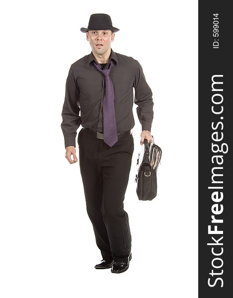 Young, attractive male model dressed soberly on tie, hat and briefcase simulates running after the cab. Young, attractive male model dressed soberly on tie, hat and briefcase simulates running after the cab