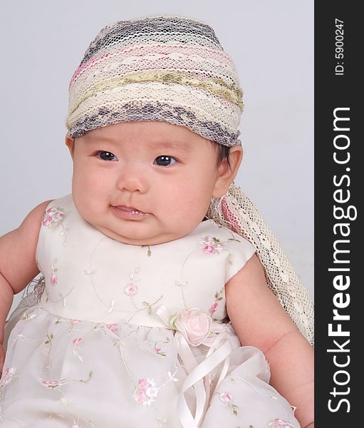 Lovely baby with scarf on her head. Lovely baby with scarf on her head