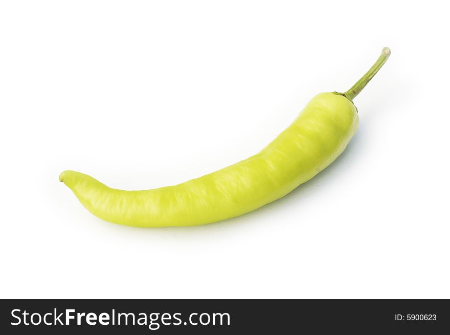 Pod of yellow-green spicy pepper isolated on white