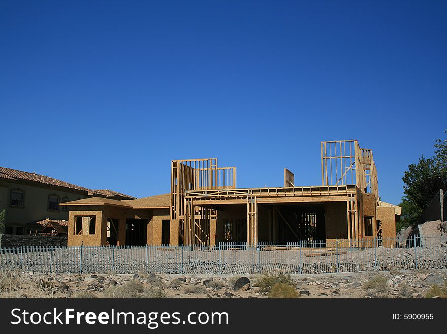 A new home under construction in the desert southwest. A new home under construction in the desert southwest
