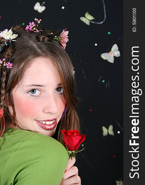 Teenage model with flowers and butterflies in her hair. Teenage model with flowers and butterflies in her hair