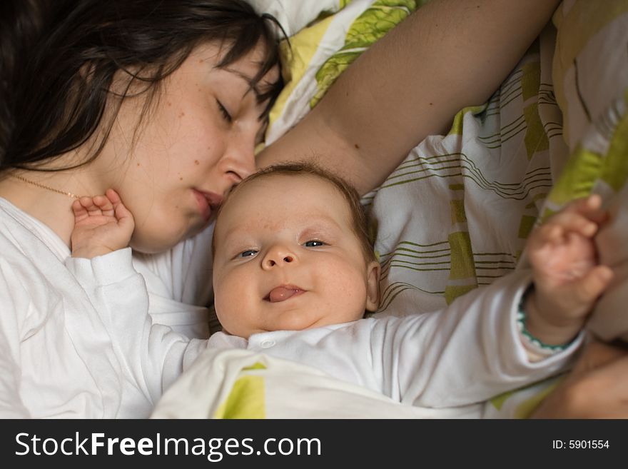 Baby with mom in the bed. Baby with mom in the bed