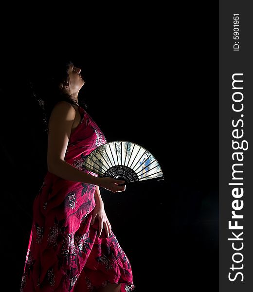 Beautiful young lady with feather night isolated black. Beautiful young lady with feather night isolated black