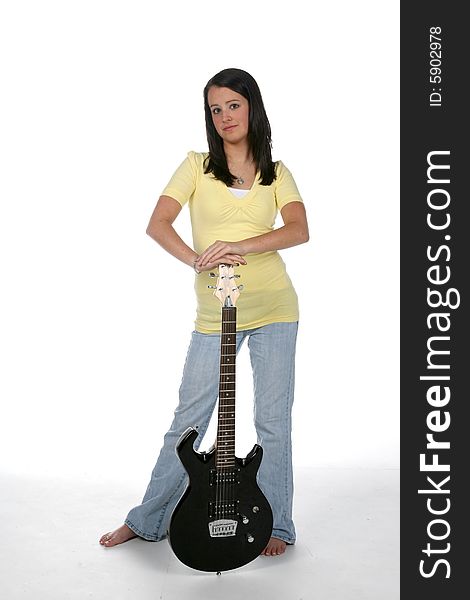 Cute teen standing with electric guitar. Cute teen standing with electric guitar