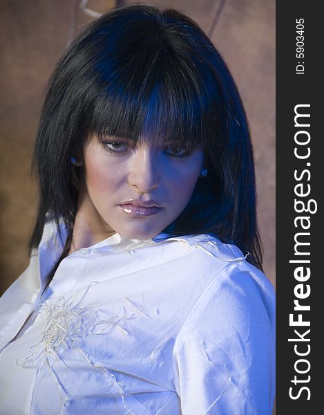 Portrait of a young lady with a white shirt with bits of straw.  There is a subtle blue tinge in her hair and on her face and shirt. Portrait of a young lady with a white shirt with bits of straw.  There is a subtle blue tinge in her hair and on her face and shirt.