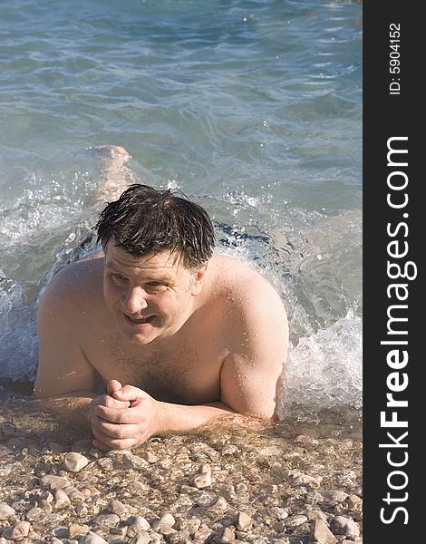 Man on the beach in summer