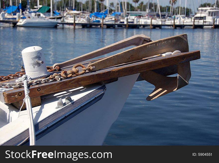 Anchor hanging off the bow of a sailboat