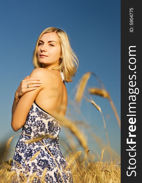 Beautiful woman in the wheat field