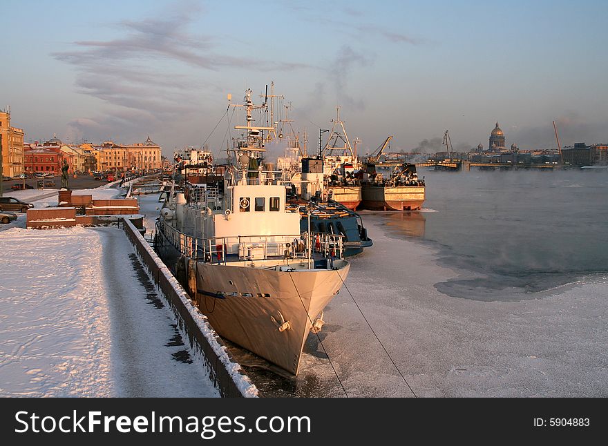 A vessel in a port near an embankment