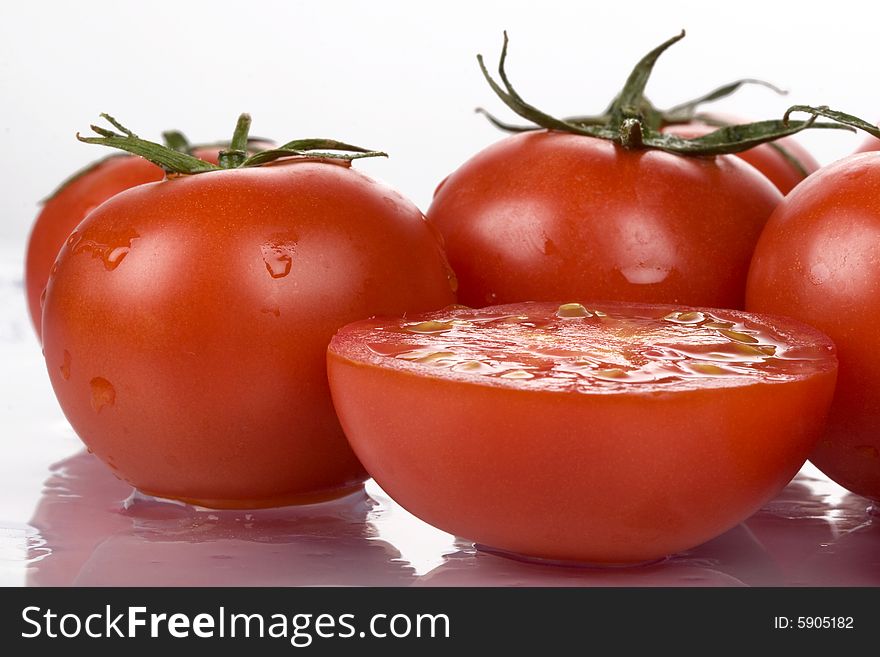 Fresh tomatoes with water drops.