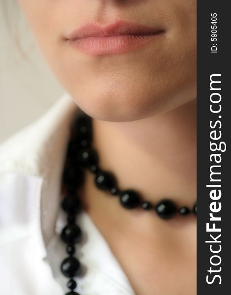 Studio shot of girl with black pearls. Studio shot of girl with black pearls