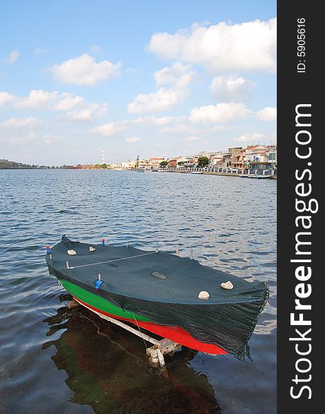 A boat in the lake of Ganzirri in the city of Messina. A boat in the lake of Ganzirri in the city of Messina