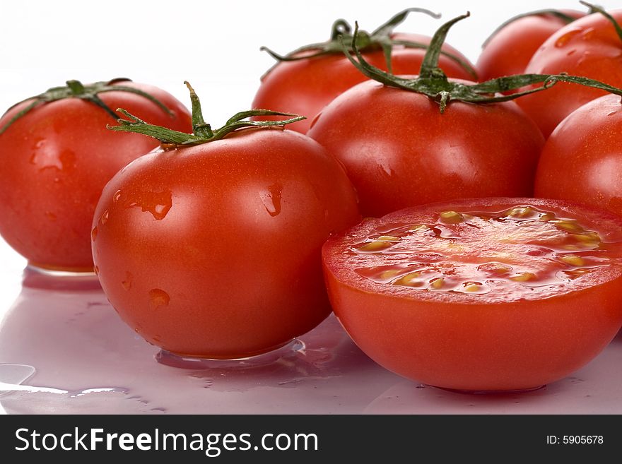 Fresh tomatoes wtih water drops.