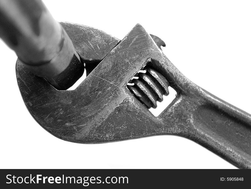 Steel wrench on white background
