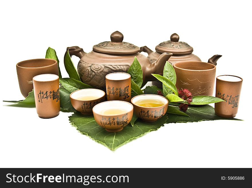 Clay teapot on a white background