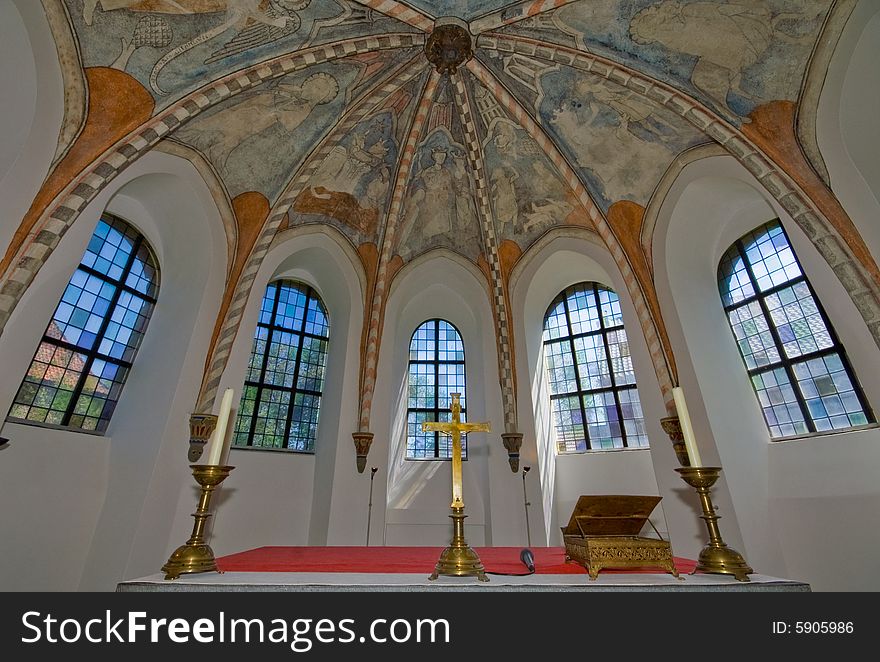 Window vieuw of a medieval church with fresco's on the ceiling. Window vieuw of a medieval church with fresco's on the ceiling