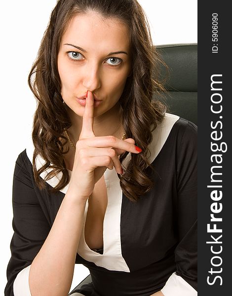 Skittish young woman touching her lips with her finger