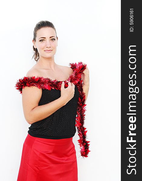 Portrait of a beautiful young brunette woman with tinsel for Christmas. Portrait of a beautiful young brunette woman with tinsel for Christmas.