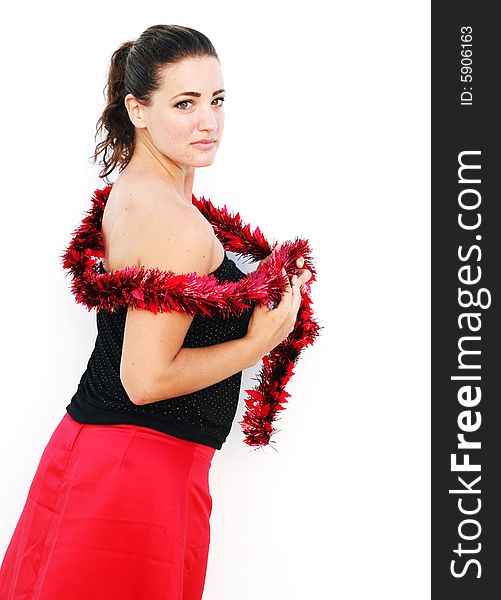 Portrait of a beautiful young brunette woman with tinsel for Christmas. Portrait of a beautiful young brunette woman with tinsel for Christmas.