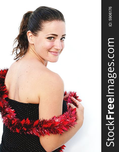 Portrait of a beautiful young brunette woman with tinsel for Christmas. Portrait of a beautiful young brunette woman with tinsel for Christmas.