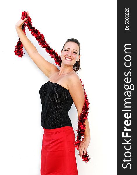 Portrait of a beautiful young brunette woman with tinsel for Christmas - isolated. Portrait of a beautiful young brunette woman with tinsel for Christmas - isolated.