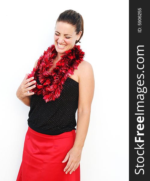 Portrait of a beautiful young brunette woman with tinsel for Christmas - isolated. Portrait of a beautiful young brunette woman with tinsel for Christmas - isolated.