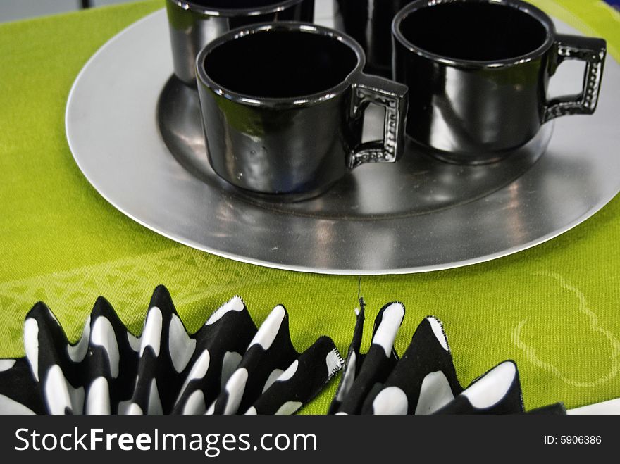 Modern set of cups on a pewter plate. Modern set of cups on a pewter plate.