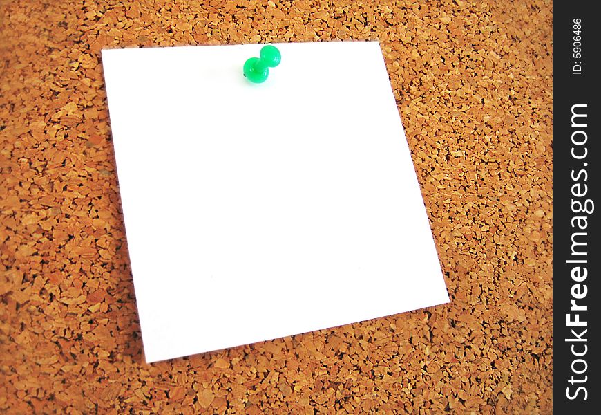 White blank note pined to cork board. White blank note pined to cork board
