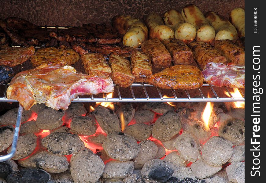 Sausages and meat on the barbecue in spring