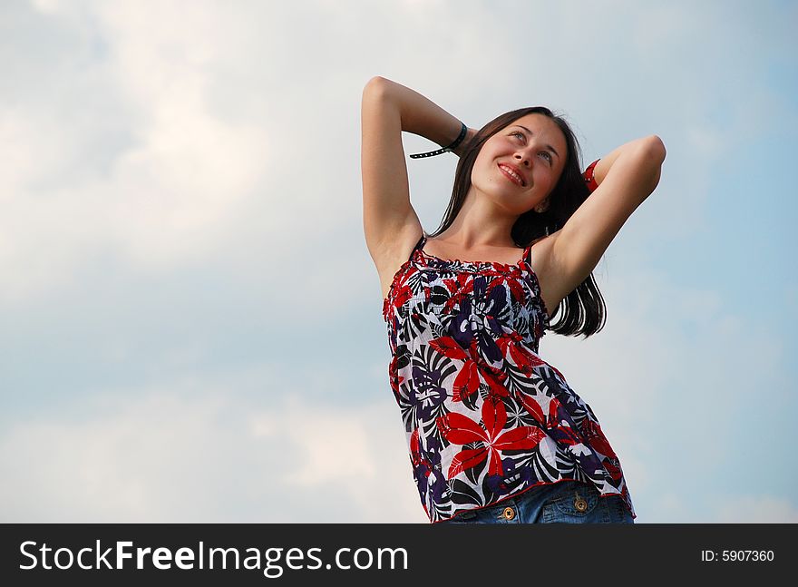 Woman On A Background Of The Sky