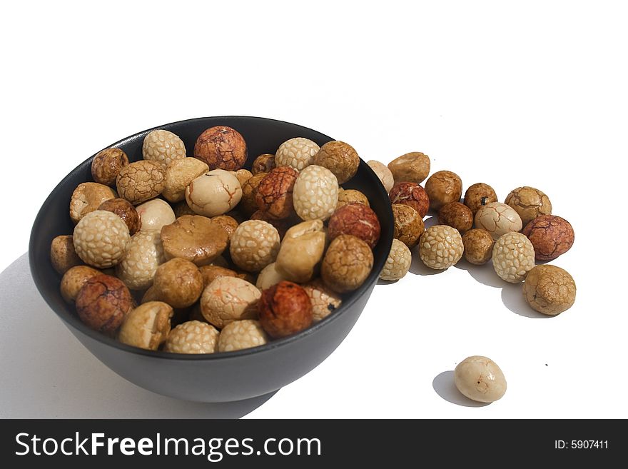 Bowl of Asian rice and sesame crackers against white background. Bowl of Asian rice and sesame crackers against white background