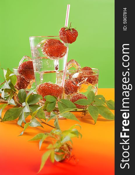 Fresh iced drink (water) served with strawberries. Fresh iced drink (water) served with strawberries