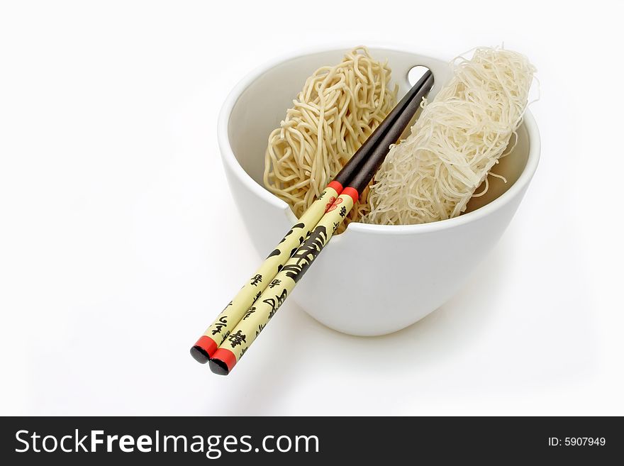Asia noodles with chopsticks in a bowl on bright background