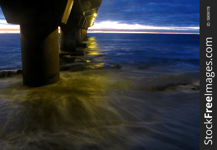 Low light photo of a bridge at sunrise