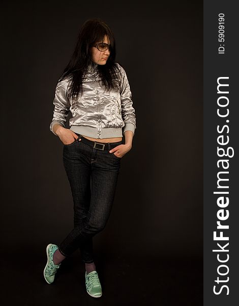 Attractive girl in casual outfit isolated on black background