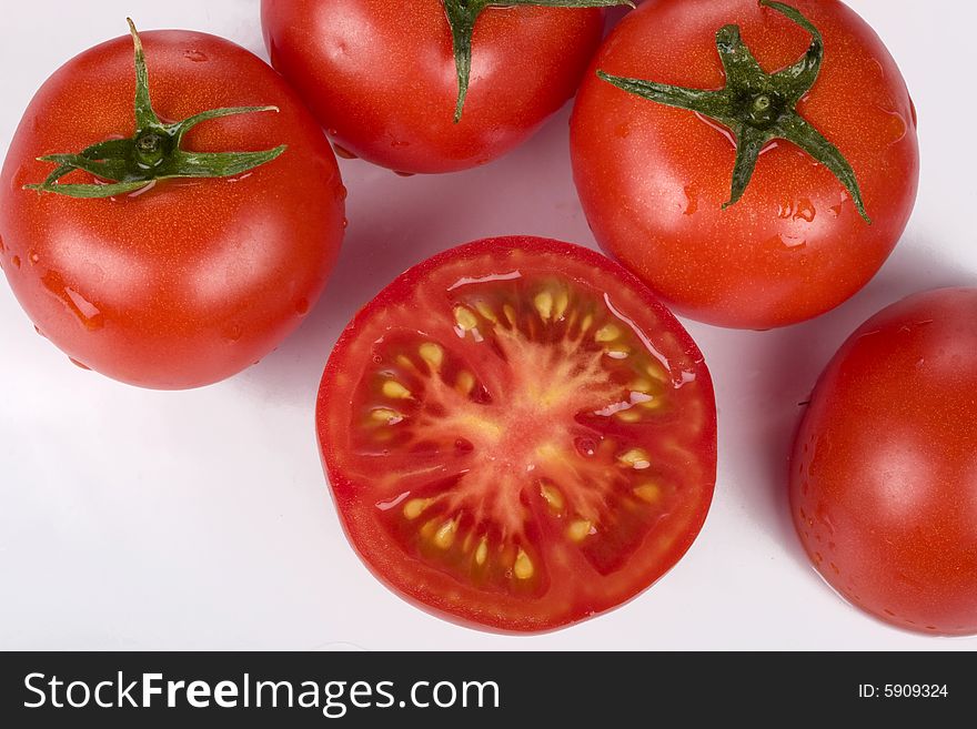 Fresh tomatoes wtih water drops.