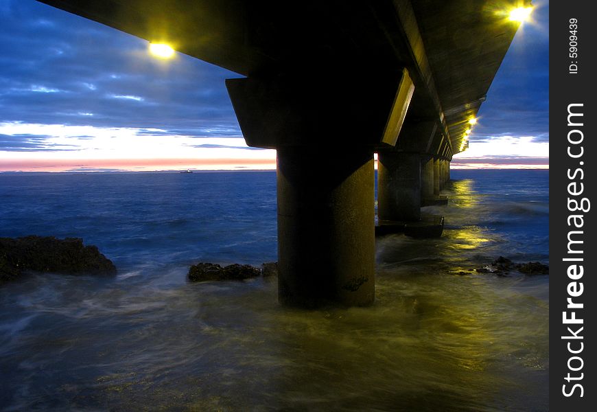 Sunrise at the pier on a winter morning with the sun about to rise. Sunrise at the pier on a winter morning with the sun about to rise