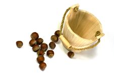 Hazelnuts And Empty Wooden Busket Stock Photos