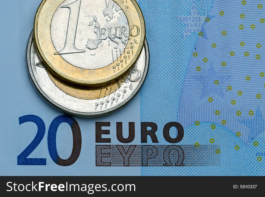 Close-up of some euros - banknote and coins. Close-up of some euros - banknote and coins.
