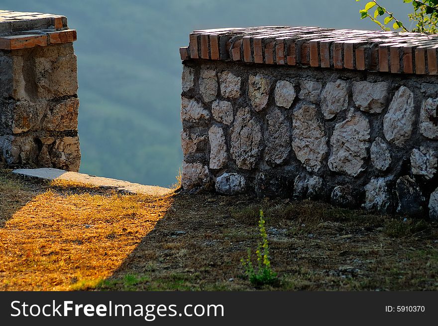 Old wall near the valley in the abruzzo region in central italy. Beautiful sunset light. Old wall near the valley in the abruzzo region in central italy. Beautiful sunset light.