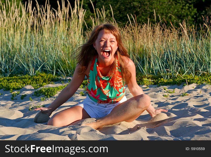 Expressive lady laughing with mouth wide open