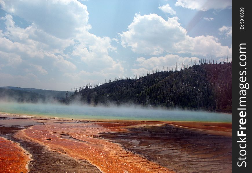 Steam rising over grand prismatic spring in yellowtone national park. Steam rising over grand prismatic spring in yellowtone national park