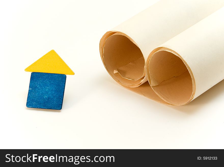 House and paper roll isolated over white background. House and paper roll isolated over white background