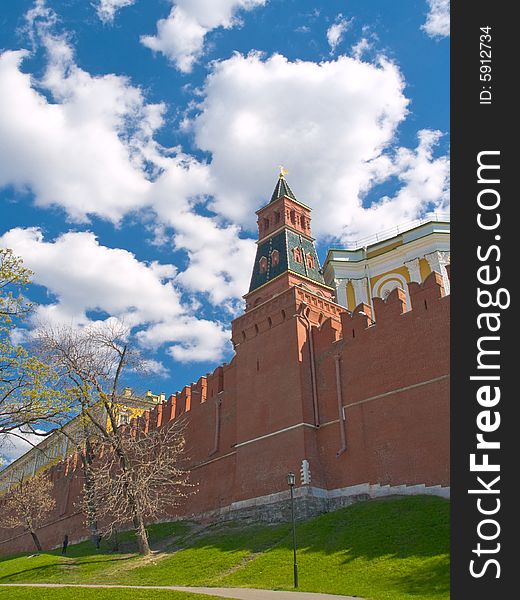 White clouds over red brick wall of Moscow Kremlin. White clouds over red brick wall of Moscow Kremlin