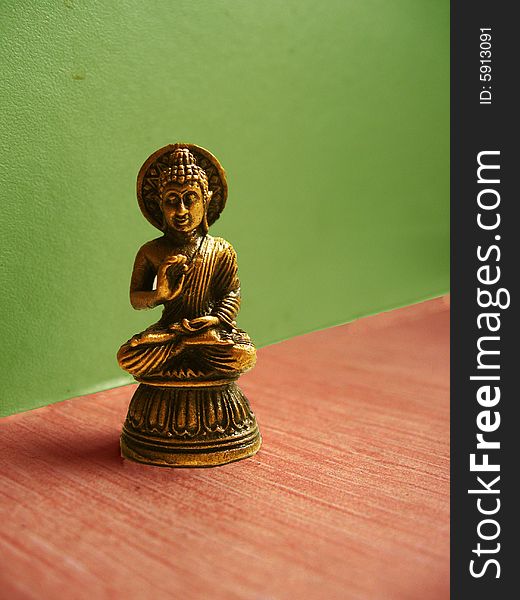 A small idol of Lord Buddha made of bronze metal