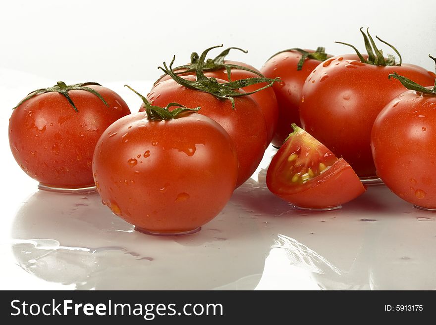 Fresh tomatoes wtih water drops.