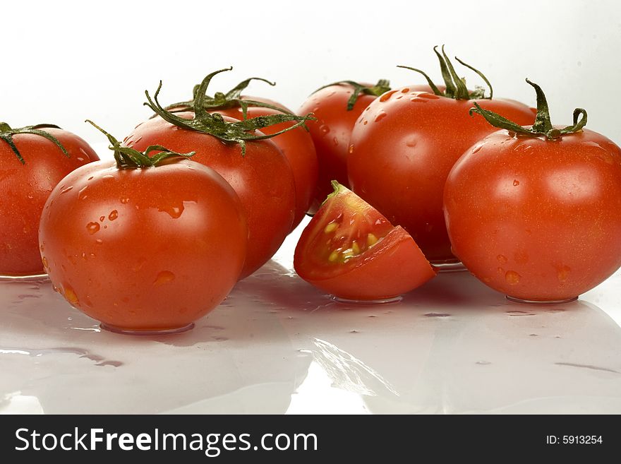 Fresh tomatoes wtih water drops.