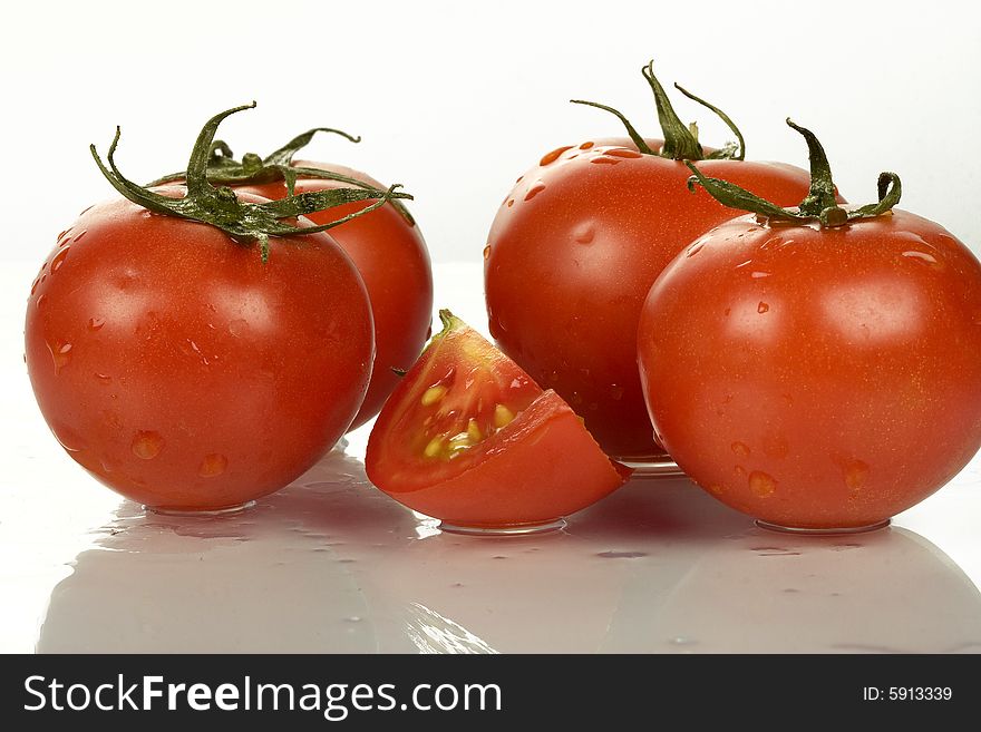 Fresh tomatoes wtih water drops.